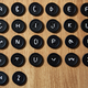 Illustration for article titled Extra Hole Buttons Let You Spell Out Messages On Your Clothing